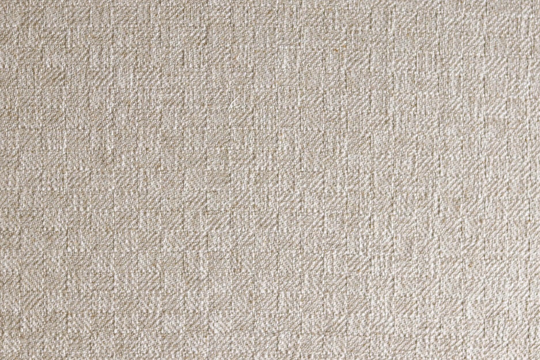 Close up of woven fabric with small scale checkerboard pattern in white and beige. 