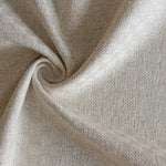 Close up of draped woven fabric with small scale checkerboard pattern in white and beige.