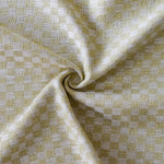 Close up of draped woven fabric with small scale checkerboard pattern in white and pale green. 