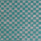 Close up of woven fabric with small scale checkerboard pattern in white and teal blue. 