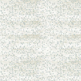 Detail of fabric in an abstract dotted pattern in light blue on a mottled cream field.