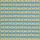 Detail of fabric in a playful dotted check print in green and blue on a cream field.