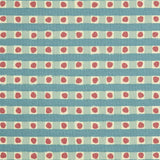 Detail of fabric in a playful dotted check print in turquoise and red on a cream field.