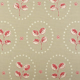 Detail of fabric in a repeating leaf print in red and cream on a light brown field.