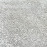 Broadloom carpet in cut pile in cool white. 
