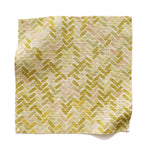 Square fabric swatch in a thatched herringbone pattern in shades of yellow, pink and green.