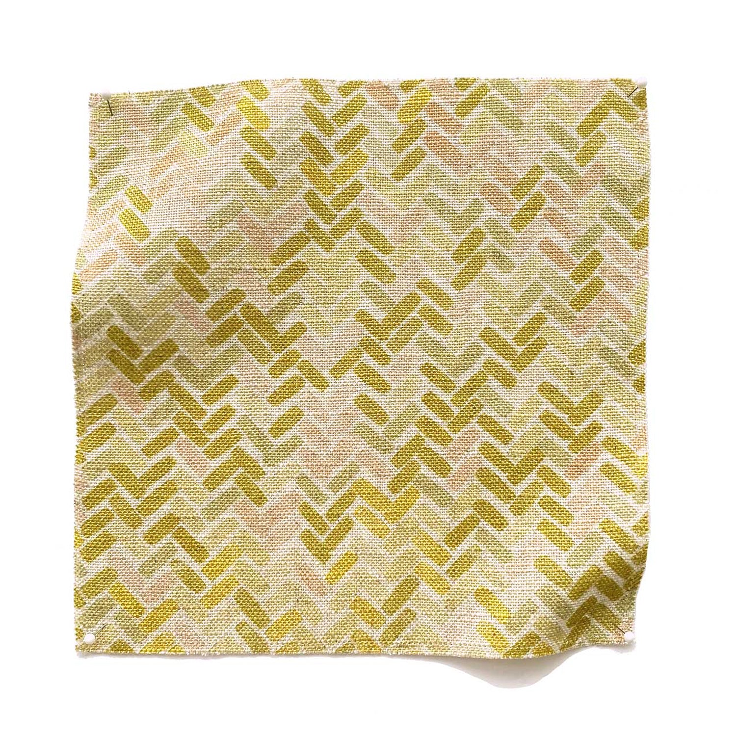 Square fabric swatch in a thatched herringbone pattern in shades of yellow, pink and green.