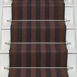 Striped flatweave runner in red ran and black on white staircase