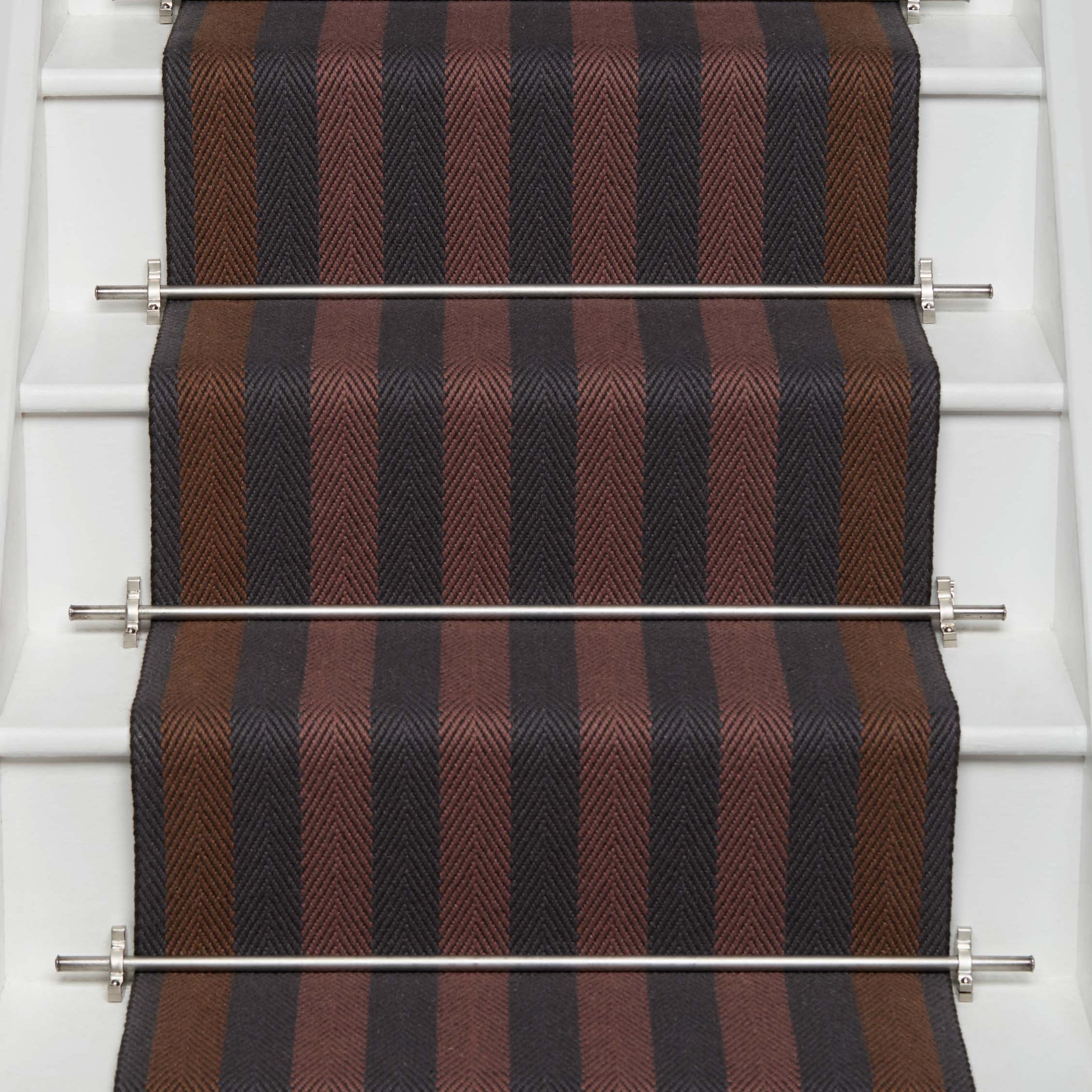Striped flatweave runner in red ran and black on white staircase