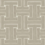 Detail of wallpaper in a large-scale interlocking geometric print in tan on a cream field.