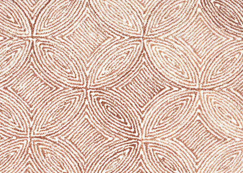 Broadloom carpet in a circular mosaic design in dense stripes of white and rust. 