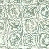 Broadloom carpet in a circular mosaic design in dense stripes of white and green.