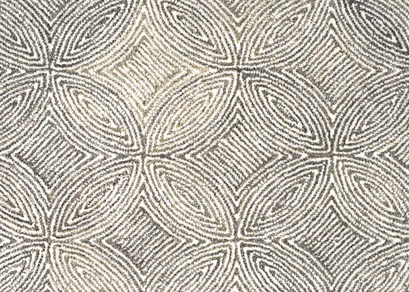 Broadloom carpet in a circular mosaic design in dense stripes of white and taupe.