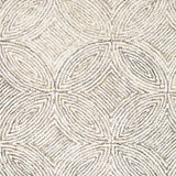 Broadloom carpet in a circular mosaic design in dense stripes of white and ecru.