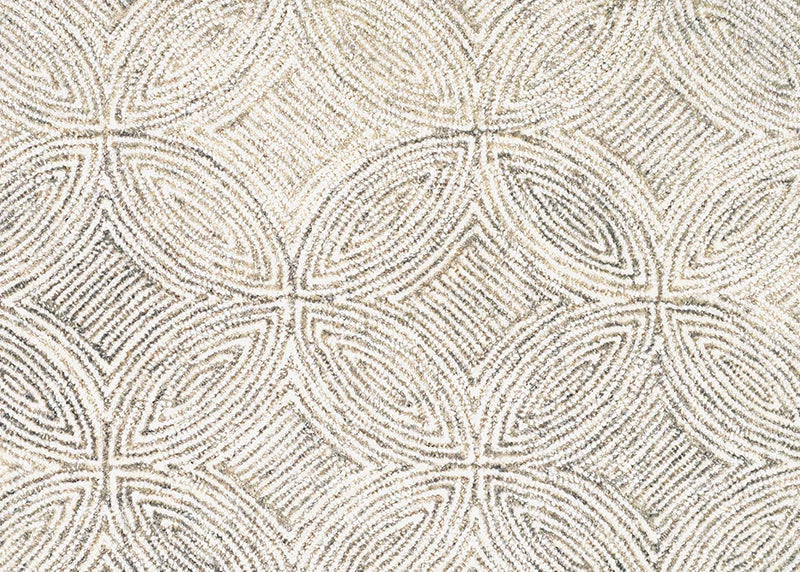 Broadloom carpet in a circular mosaic design in dense stripes of white and ecru.