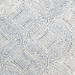 Broadloom carpet in a circular mosaic design in dense stripes of white and coll grey.