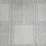 Broadloom carpet in wide box checkerboard pattern in cream and grey.
