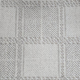 Broadloom carpet in wide box checkerboard pattern in cream and grey.