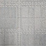 Broadloom carpet in wide box checkerboard pattern in light blue and cream. 