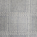 Broadloom carpet in wide box checkerboard pattern in cream and light blue.