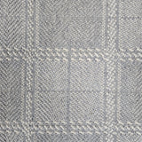 Broadloom carpet in wide box checkerboard pattern in cream and light blue.