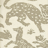 Detail of wallpaper in a playful animal print in tan on a cream field.