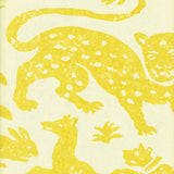 Detail of wallpaper in a playful animal print in yellow on a cream field.
