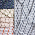 Gently draped fabric cuttings with small scale geometric design in various colors. 