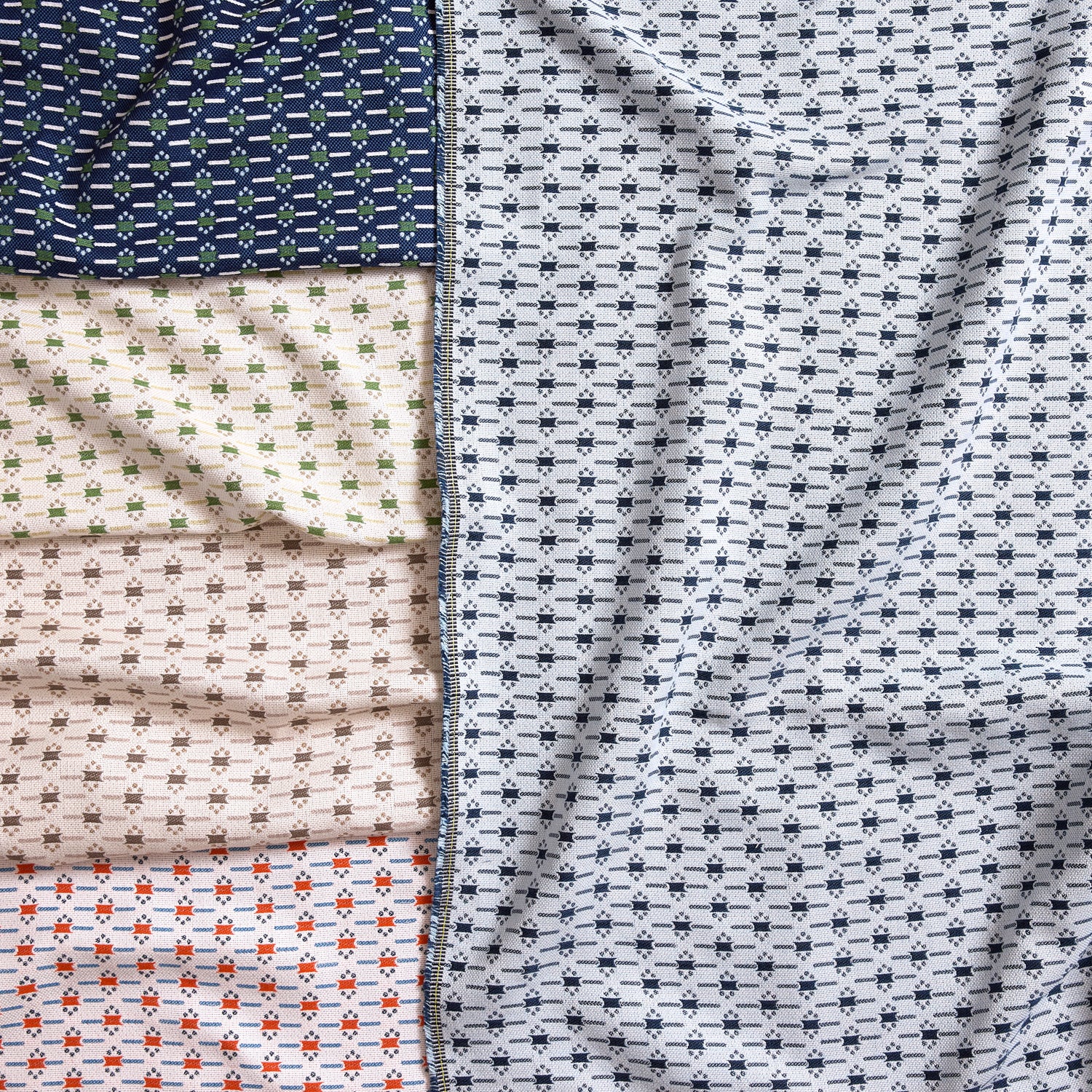 Gently draped fabric cuttings with small scale geometric design in various colors. 