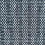 printed linen fabric in a repeating knotted pattern in indigo on a white field.