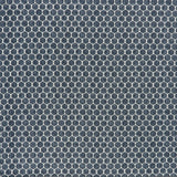 printed linen fabric in a repeating knotted pattern in indigo on a white field.