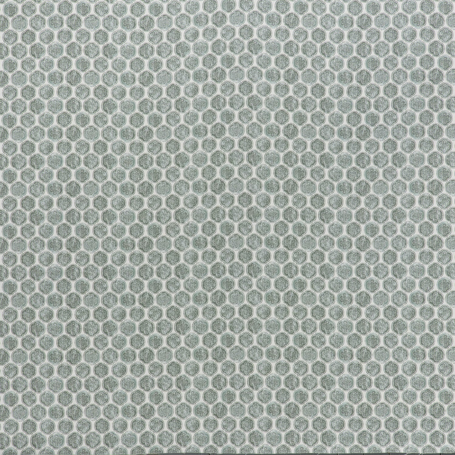 printed linen fabric in a repeating knotted pattern in jade on a white field.