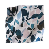 Square fabric swatch in a minimal leaf print in shades of blue, brown and pink on a tan field.