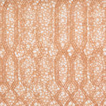 Printed fabric with monochomatic geometric stripe and mottled textural background in shades of orange.