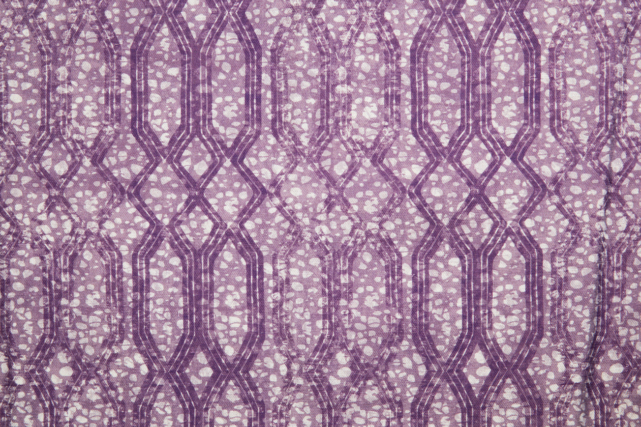 Printed fabric with monochomatic geometric stripe and mottled textural background in shades of purple.