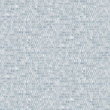Detail of wallpaper in a textural geometric print in shades of blue on a white field.