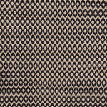 Handwoven wool rug with textural oval pattern in dark brown on a beige field. 