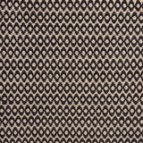 Handwoven wool rug with textural oval pattern in dark brown on a beige field. 