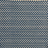 Handwoven wool rug with textural oval pattern in marine blue on a beige field. 