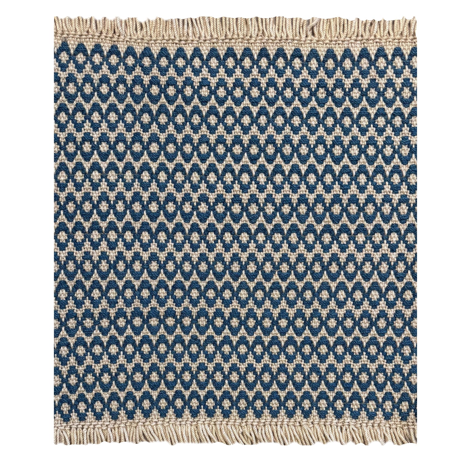 A woven rug sample with a marine blue and cream geometric oval pattern and fringed edges, shown flat against a white background.
