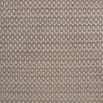 Handwoven wool rug with textural oval pattern in grey on a beige field. 