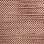 Handwoven wool rug with textural oval pattern in blush pink on a beige field. 