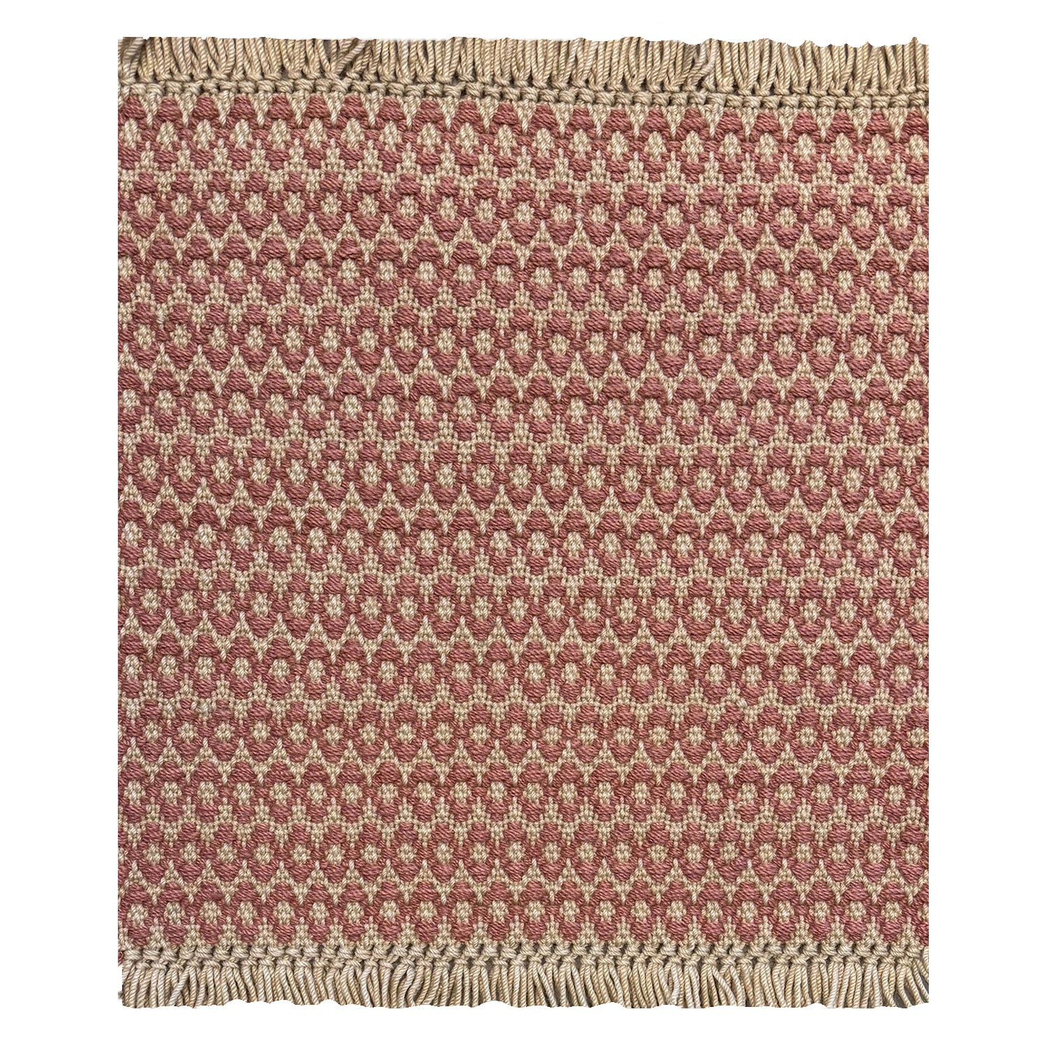 A woven rug sample with a blush pink and cream geometric oval pattern and fringed edges, shown flat against a white background.