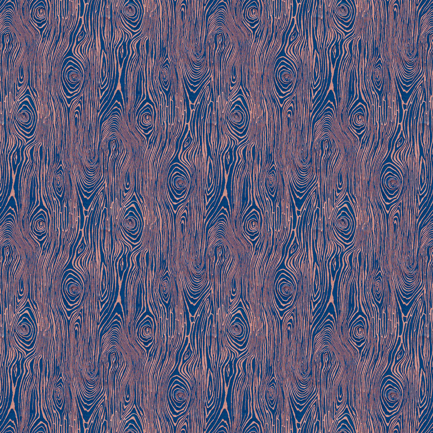 Scaled-out view of fabric in a textural wood grain print in pink on a blue field.