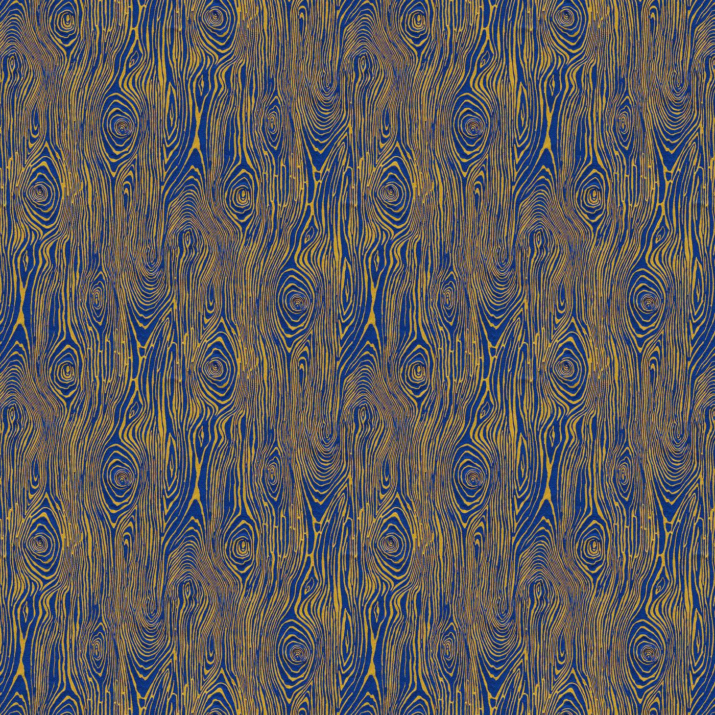 Scaled-out view of fabric in a textural wood grain print in yellow on a blue field.