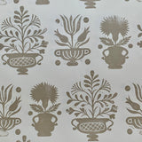 Detail of wallpaper in a repeating vase and plant print in gray on a white field.