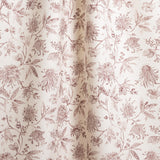 Draped fabric in a watercolor floral pattern with wine-purple leaves and flowers on a cream background