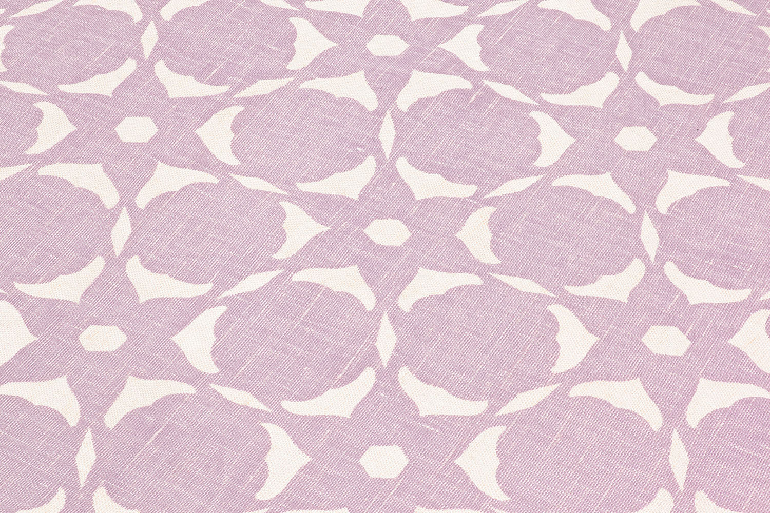Fabric yardage in a floral lattice print in cream on a light purple field.