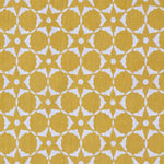 Fabric in a floral lattice print in white on a mustard field.