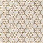 Fabric in a floral lattice print in bronze on a cream field.